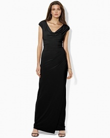 Crafted from fluid matte jersey, this graceful gown features an elegant draped neckline and flattering side-ruching for a sophisticated evening look. Crafted from fluid matte jersey, this graceful gown features an elegant draped neckline and flattering side-ruching for a sophisticated evening look.