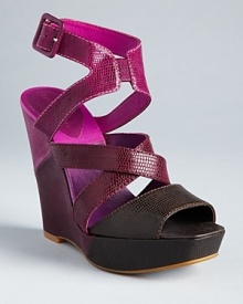 Lizard-embossed uppers give strappy platform wedge sandals an extra does of style; from Juicy Couture. Lizard-embossed uppers give strappy platform wedge sandals an extra does of style; from Juicy Couture.