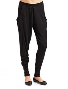 THE LOOKRibbed elastic waistband with drawstringSide draped pocketsRibbed and banded cuffs with zipper closuresTHE FITRise, about 12 Inseam, about 32THE MATERIAL40% nylon/30% viscose/30% mercerized woolCARE & ORIGINDry cleanImported THE LOOKRibbed elastic waistband with drawstringSide draped pocketsRibbed and banded cuffs with zipper closuresTHE FITRise, about 12 Inseam, about 32THE MATERIAL40% nylon/30% viscose/30% mercerized woolCARE & ORIGINDry cleanImported