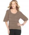 A unique shape and a textural knit distinguish this Cable & Gauge sweater – perfect for pairing with a bold necklace or pin!