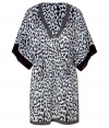 Stylish caftan in fine, light blue cotton - Elegant, on-trend leopard print - Lightweight and fluid, hits above the knee - Stripe trim at deep V-neck and hem - Oversize, elbow-length sleeves - Cinched waist with skinny tie - Chic slits at side - A dream go-to for your next beach getaway - Also works layered over leggings and skinny denim with sandals