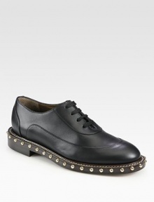 Luminous metal studs revitalize this classic leather silhouette with a moderate stacked heel. Stacked heel, 1¼ (30mm)Leather upperLeather lining and solePadded insoleMade in Italy Luminous metal studs revitalize this classic leather silhouette with a moderate stacked heel. Stacked heel, 1¼ (30mm)Leather upperLeather lining and solePadded insoleMade in Italy