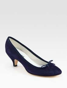 A quietly elegant pump rendered in butter-soft suede, with simple ribbon trim and a lifted heel. Self-covered heel, 2½ (65mm)Suede upper with grosgrain ribbon trimLeather lining and solePadded insoleMade in France A quietly elegant pump rendered in butter-soft suede, with simple ribbon trim and a lifted heel. Self-covered heel, 2½ (65mm)Suede upper with grosgrain ribbon trimLeather lining and solePadded insoleMade in France