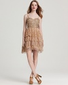 Achieve party perfection in this Aidan Mattox dress, featuring a sparkling sequin bodice atop a lace tiered skirt.
