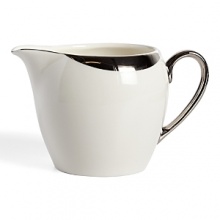 This creamer glows with a hand-painted bright platinum design to create a contemporary classic on your table that will complement your dining experience throughout a lifetime of shifting trends and evolving fashions. This creamer glows with a hand-painted bright platinum design to create a contemporary classic on your table that will complement your dining experience throughout a lifetime of shifting trends and evolving fashions.