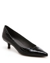 Kitten heel meets embossed croc in these elegantly crafted Stuart Weitzman pointed toe pumps.