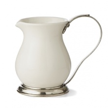 This revolutionary collection combines white ceramic with hand-finished pewter trim, creating a stunning marriage of light and shadow. The entire collection is dishwasher safe. This revolutionary collection combines white ceramic with hand-finished pewter trim, creating a stunning marriage of light and shadow. The entire collection is dishwasher safe.
