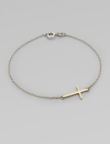 A simple, sleek cross of 14k gold sits sideways within a delicate sterling silver chain in this eloquent design.14k yellow gold and sterling silverLength, about 7Spring ring claspMade in USA A simple, sleek cross of 14k gold sits sideways within a delicate sterling silver chain in this eloquent design.14k yellow gold and sterling silverLength, about 7Spring ring claspMade in USA