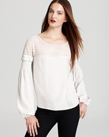 Soft touches of lace romance your fall wardrobe, proven by this Madison Marcus top, flaunting feminine bell sleeves for a beautiful, boho look. Soft touches of lace romance your fall wardrobe, proven by this Madison Marcus top, flaunting feminine bell sleeves for a beautiful, boho look.
