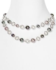 Scattered with tonal pearls, Majorica's double strand necklace is a striking take on a jewel box classic. Layer it over an all-black palette for maximum pop. Scattered with tonal pearls, Majorica's double strand necklace is a striking take on a jewel box classic. Layer it over an all-black palette for maximum pop.