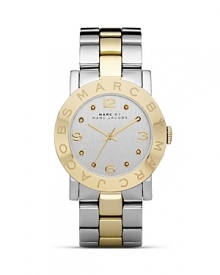 Put a distinctive duo-tone spin on your wrist wear collection with this watch from MARC BY MARC JACOBS. It's classic, gleaming style lends every look a timeless touch.