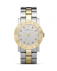 Put a distinctive duo-tone spin on your wrist wear collection with this watch from MARC BY MARC JACOBS. It's classic, gleaming style lends every look a timeless touch.