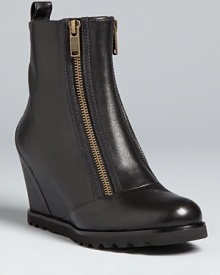 Like the moto look but want some height? These MARC BY MARC JACOBS booties have it all, set on walkable wedges that will have you pounding the pavement in high style. Like the moto look but want some height? These MARC BY MARC JACOBS booties have it all, set on walkable wedges that will have you pounding the pavement in high style.