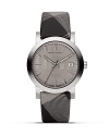 Burberry's ultramodern watch with matte steel casing, granite-tone face and check strap.