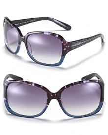 Fall in love with these oversized two-color sunglasses with silvertone glitter heart embellishments along arms. Fall in love with these oversized two-color sunglasses with silvertone glitter heart embellishments along arms.