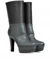 Dont let cold weather foil your stylelook chic and stand tall in these grip sole combo-leather boots from Sergio Rossi - Round toe, ultra-high front platform, chunky high heel, crisscross side detail with grommets, smooth leather upper with textured leather at ankles, pull-on style - Wear with skinny jeans, a mini-skirt, or leggings