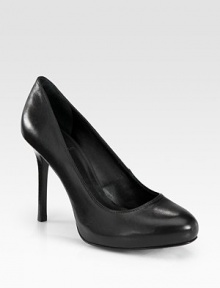 A wardrobe essential of sumptuous leather with a powerful stacked heel. Stacked heel, 4 (100mm)Leather upperLeather lining and solePadded insoleImported A wardrobe essential of sumptuous leather with a powerful stacked heel. Stacked heel, 4 (100mm)Leather upperLeather lining and solePadded insoleImported
