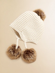 Crafted in a solid classic knit, our vintage-inspired earflap hat is adorned with stylish faux fur trim for a timeless look.Knit crownEarflaps with pom-pom tassels tie beneath the chinWool/CashmereDry cleanImported