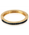 Wrist watching will be the order of the day with this bracelet from Kenneth Cole New York. Crafted from gold-tone mixed metal and adorned with blue glass crystal accents, the bracelet will make sure all eyes are on you. Approximate diameter: 2-1/4 inches.