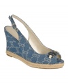 Show off sophisticated summer style with the Olexa wedges by Etienne Aigner. Their denim upper features a subtle logo print and the peep-toe is topped with a metal logo buckle.