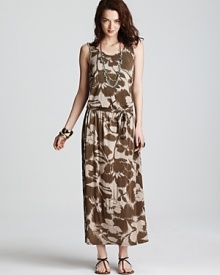 Camouflage goes chic as this MICHAEL Michael Kors maxi dress plays up a natural color palette with an oversized floral print. Garnish with gold accents for 24-7 style. Camouflage goes chic as this MICHAEL Michael Kors maxi dress plays up a natural color palette with an oversized floral print. Garnish with gold accents for 24-7 style.