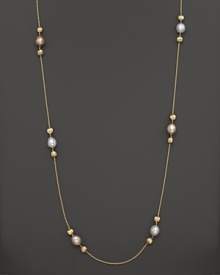 White and peach pearls create gleaming contrast with textured 18K yellow gold beads. From the Africa Pearl Collection. White and peach pearls create gleaming contrast with textured 18K yellow gold beads. From the Africa Pearl Collection.