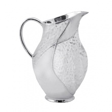 Shaped by hand of durable recycled aluminum, this striking pitcher from Mariposa is detailed with a softly textured finish and beaded edges for a look that's at once organic and refined. Shaped by hand of durable recycled aluminum, this striking pitcher from Mariposa is detailed with a softly textured finish and beaded edges for a look that's at once organic and refined.