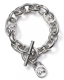 Go chunky-chic with MICHAEL Michael Kors' boldly sized chain bracelet. Work or weekend, slip on this silvery style to give your cuff sartorial weight. Go chunky-chic with MICHAEL Michael Kors' boldly sized chain bracelet. Work or weekend, slip on this silvery style to give your cuff sartorial weight.