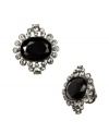 Diminutive yet dramatic. Add elegance to your daytime or evening look with Givenchy's chic clip on button earrings. Set in silver tone mixed metal, they're embellished with jet and black glass accents. Approximate diameter: 3/4 inch.
