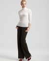 Warm up to cool-weather style in this C by Bloomingdale's turtleneck--rendered in sumptuous cashmere for luxe, everyday wear.