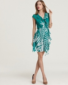 A palm-leaf print brings tropical chic while a cascading ruffle lends feminine flair to this Milly wrap dress of supple silk. A palm-leaf print brings tropical chic while a cascading ruffle lends feminine flair to this Milly wrap dress of supple silk.