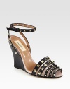Soft nappa leather wedge with a wrap-around ankle strap, roughened by on-trend studs. Self-covered wedge, 4 (100mm)Nappa leather upperLeather lining and solePadded insoleMade in ItalyOUR FIT MODEL RECOMMENDS ordering one half size up as this style runs small. 