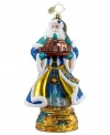 In sparkling blue and gold hues, cheery Santa Claus holds a small replica of the city of Bethlehem in this hand-painted ornament from Christopher Radko.
