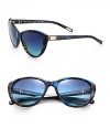 A feminine cat's-eye design is ultra-versatile and lightweight in acetate. Available in black with smoke gradient lens or flame blue with blue gradient lens. Metal logo plaque templesUV400 protectionMade in Italy 