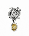 A bezel-set bear quartz dangles from a sterling silver knotted charm. By PANDORA.