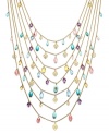 Attract a little attention. Lauren by Ralph Lauren's dramatic 7-row necklace features charms in reconstituted turquoise and glass in a range of pastel hues. Set in gold tone mixed metal. Approximate length: 22 inches to 37 inches.