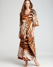 An abstract mix of tiger stripes and leopard spots covers this Natori robe, featuring ruffle trim at the waist. An abstract mix of tiger stripes and leopard spots covers this Natori robe, featuring ruffle trim at the waist.