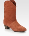 Rich leather trim finishes this western-inspired shape of fine suede. Stacked heel, 1¾ (45mm)Shaft, 9¾Leg circumference, 12Suede upper with leather trimLeather liningLeather and rubber solePadded insoleImportedOUR FIT MODEL RECOMMENDS ordering one half size up as this style runs small. 
