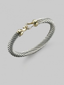 From the Cable Buckle Collection. A classic cable bangle of sterling silver, clasped with a pavé diamond buckle and accented with 18k yellow gold. Diamonds, 0.09 tcw Sterling silver and 18k yellow gold Cable, 7mm Diameter, about 2¼ Hook clasp Made in USA From the Cable Buckle Collection. A classic cable bangle of sterling silver, clasped with a pavé diamond buckle and accented with 18k yellow gold. Diamonds, 0.09 tcw Sterling silver and 18k yellow gold Cable, 7mm Diameter, about 2¼ Hook clasp Made in USA