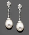 Swinging style you'll always love. These beautiful drop earrings feature cultured freshwater pearls (7.5-8 mm) and diamond accents set in 14k white gold. Approximate drop: 1-1/4 inches.