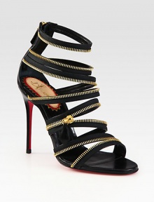 Bands of soft-stretch leather and fierce goldtone zipper trim defines this heightened silhouette. Leather-covered heel, 4 (100mm)Elastic-covered leather upper with zipper trimBack zipLeather liningSignature red leather solePadded insoleMade in Italy