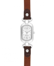 Petite with subtle elegance, by Nine West. Watch crafted of brown leather strap and oval silver tone mixed metal case. Silver tone dial features tonal applied stick indices, numerals at twelve and six o'clock, silver tone hour and minute hands, sweeping second hand and logo at six o'clock. Quartz movement. Limited lifetime warranty. Petite with subtle elegance, by Nine West. Watch crafted of brown leather strap and oval silver tone mixed metal case. Silver tone dial features tonal applied stick indices, numerals at twelve and six o'clock, silver tone hour and minute hands, sweeping second hand and logo at six o'clock. Quartz movement. Limited lifetime warranty.