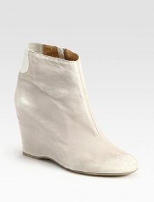 Brushed leather style enlivened by an exposed side zipper, hidden wedge and elastic details. Hidden wedge, 3 (75mm)Leather and elastic upperSide zipperLeather liningRubber solePadded insoleImportedOUR FIT MODEL RECOMMENDS ordering one half size up as this style runs small. Brushed leather style enlivened by an exposed side zipper, hidden wedge and elastic details. Hidden wedge, 3 (75mm)Leather and elastic upperSide zipperLeather liningRubber solePadded insoleImportedOUR FIT MODEL RECOMMENDS ordering one half size up as this style runs small.