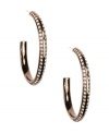Adorned with an array of sparkling glass accents, Givenchy's hoop earrings look gorgeous from every angle. Crafted in brown gold tone mixed metal. Approximate diameter: 1-3/4 inches.