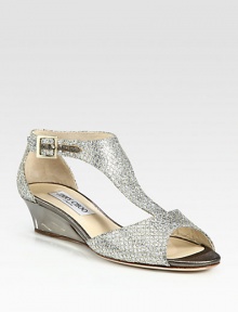 Shimmer-kissed, glittery silhouette with a textured mesh overlay and minimal wedge heel. Lacquered wedge, 1½ (40mm)Glitter-coated fabric upperAdjustable ankle strapLeather lining and solePadded insoleMade in Italy Shimmer-kissed, glittery silhouette with a textured mesh overlay and minimal wedge heel. Lacquered wedge, 1½ (40mm)Glitter-coated fabric upperAdjustable ankle strapLeather lining and solePadded insoleMade in Italy
