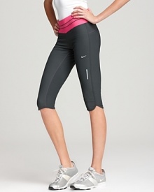 A sleek design with a colorful contrasting waistband, these Nike capri pants boast Dri-FIT technology to wick away moisture. A sleek design with a colorful contrasting waistband, these Nike capri pants boast Dri-FIT technology to wick away moisture.