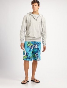 Classic swim trunk style comes to life in a bright floral print pattern, with side pocket detail in quick-drying nylon.Drawstring tie waistInseam, about 10Fully linedPolyesterMachine washImported Classic swim trunk style comes to life in a bright floral print pattern, with side pocket detail in quick-drying nylon.Drawstring tie waistInseam, about 10Fully linedPolyesterMachine washImported