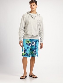 Classic swim trunk style comes to life in a bright floral print pattern, with side pocket detail in quick-drying nylon.Drawstring tie waistInseam, about 10Fully linedPolyesterMachine washImported