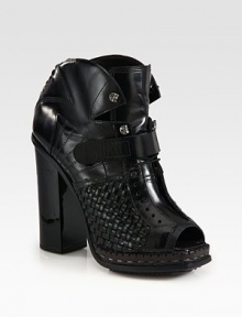 Woven leather forms this edgy lace-up design with a chunky lacquered heel, intricate stitching and curved edges for architectural appeal. Lacquered heel, 4¼ (110mm)Leather platform, ½ (15mm)Compares to a 3¾ heel (95mm)Leather upper with a velcro leather strapPeep toeLaced backLeather lining and solePadded insoleMade in Italy
