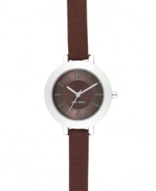 Walk the line between casual and dressy with this Nine West watch. Crafted of brown leather strap and round silver tone mixed metal case. Brown textured dial features silver tone hour and minute hands, sweeping second hand, applied numerals at twelve and six o'clock, stick indices and logo at six o'clock. Quartz movement. Limited lifetime warranty. Walk the line between casual and dressy with this Nine West watch. Crafted of brown leather strap and round silver tone mixed metal case. Brown textured dial features silver tone hour and minute hands, sweeping second hand, applied numerals at twelve and six o'clock, stick indices and logo at six o'clock. Quartz movement. Limited lifetime warranty.